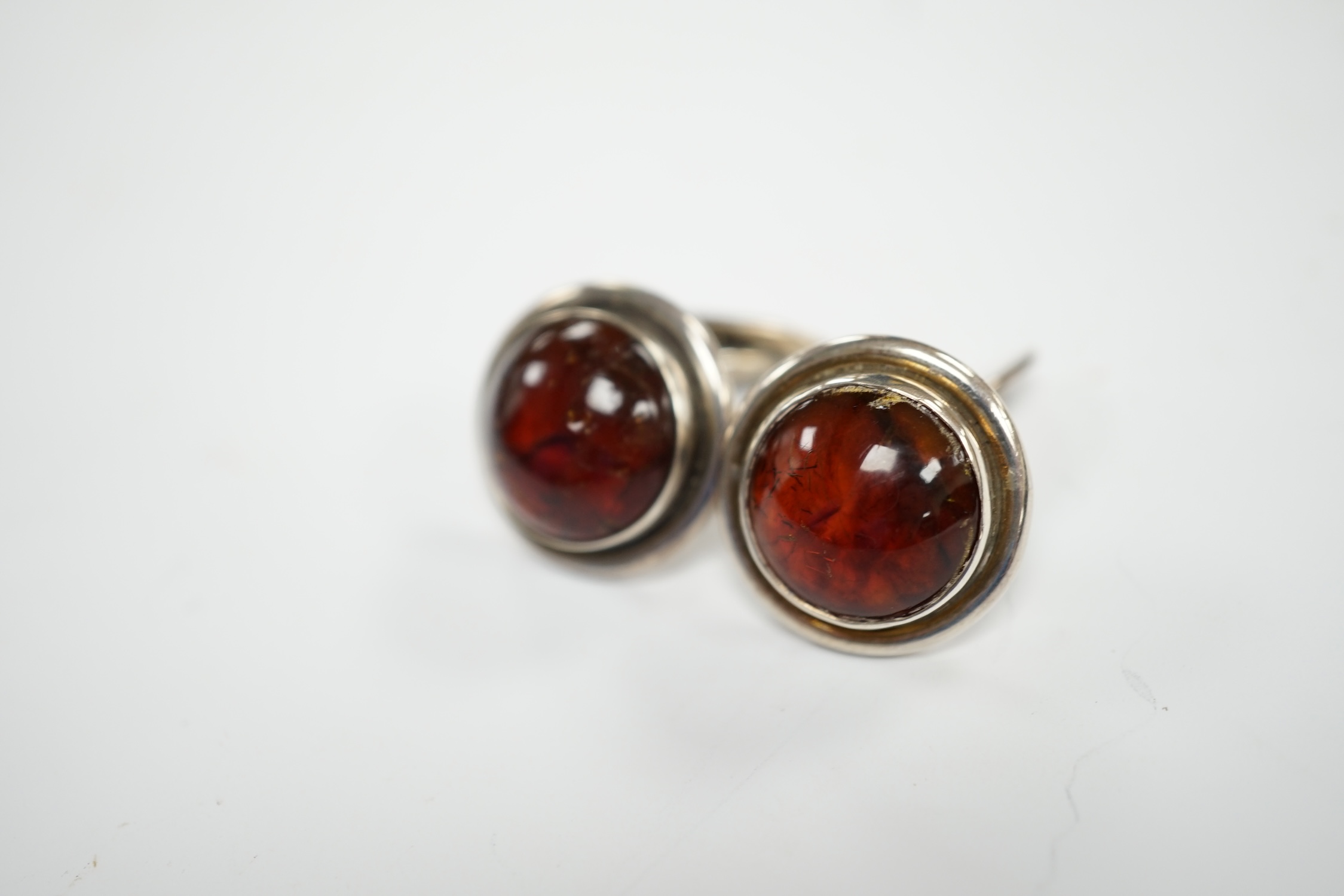 A pair of mid 20th century Danish sterling and cabochon amber set cufflinks, by Carl Ove Frydensberg, diameter 20mm.